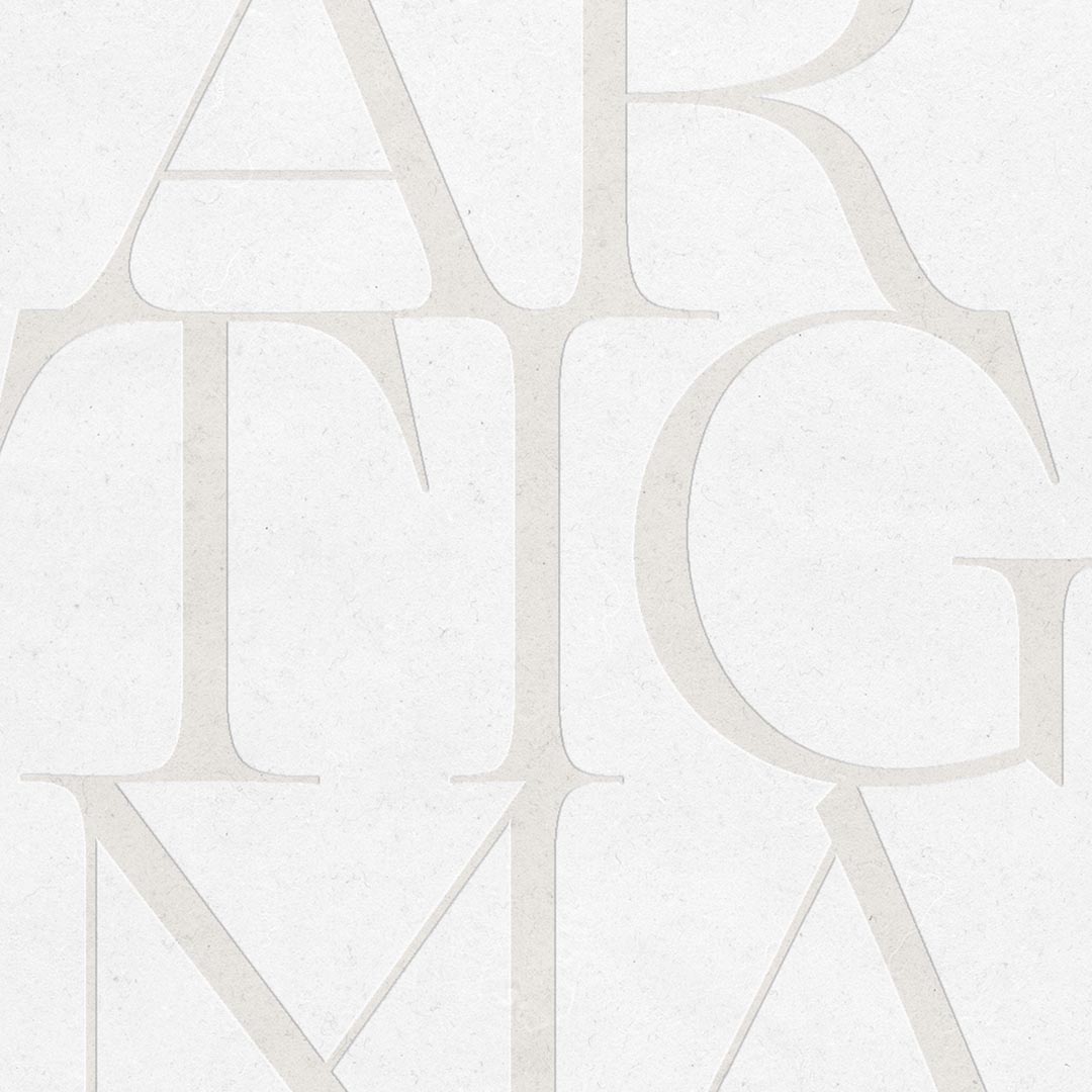 ARTIGMA felirat halvány, texturált háttéren márkaépítési vizuális koncepció részeként